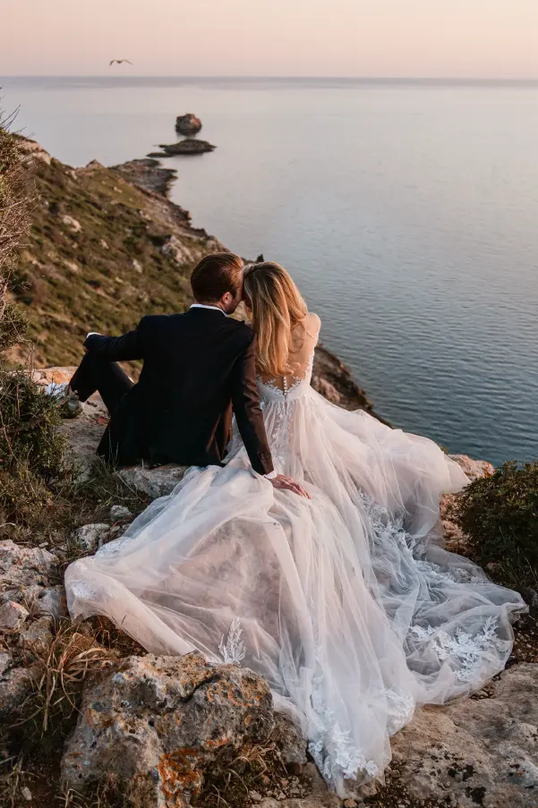 Couple enjoying sunset overlooking the ocean after their wedding in Mallorca