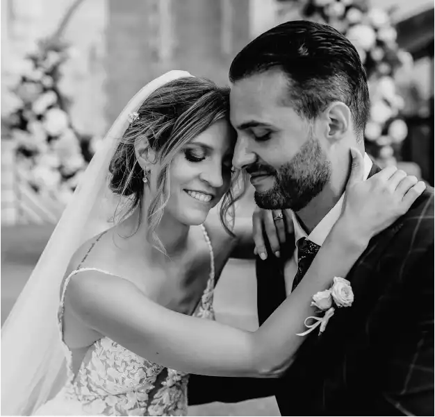 A couple shares a romantic moment during their wedding ceremony.