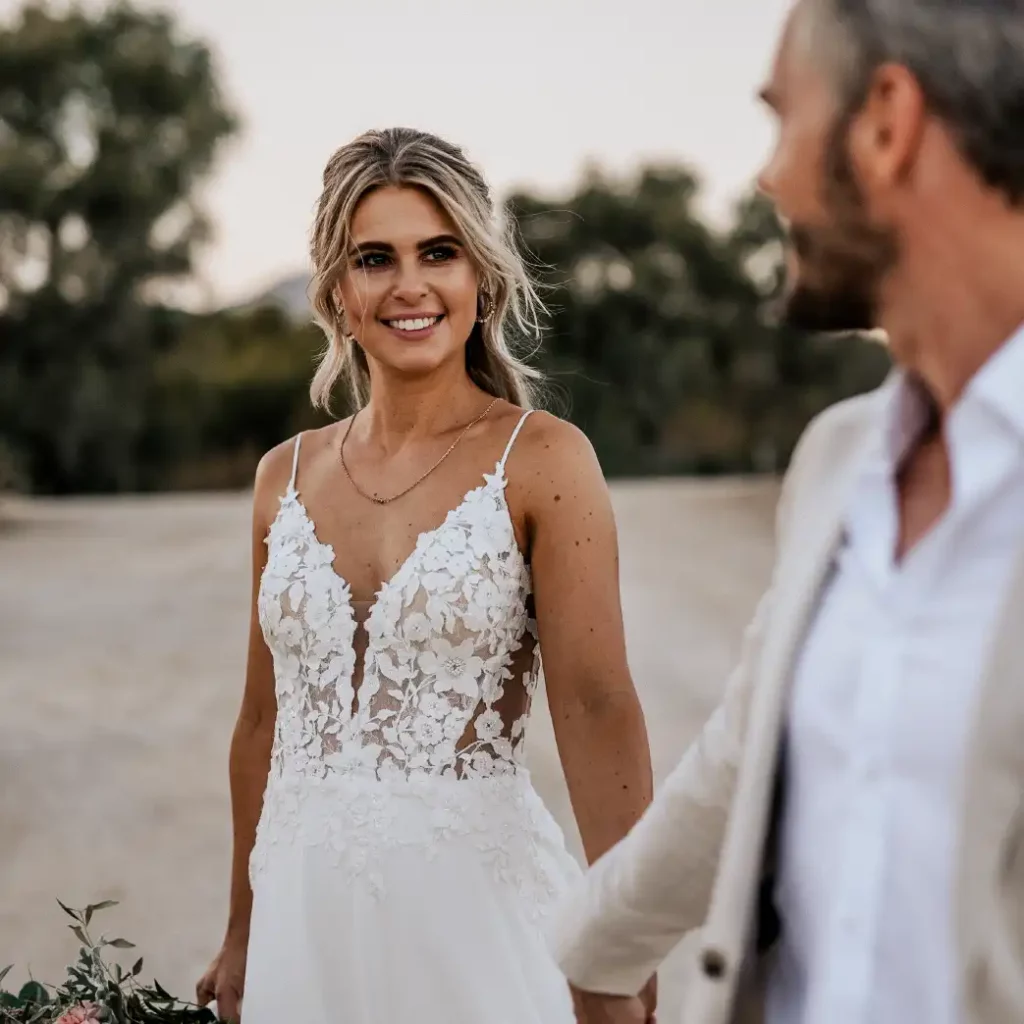 Emotional moment after the wedding in Mallorca. The couple are looking at each other happily.