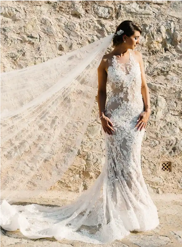 Bride posing with beautiful wedding dress by Galia Lahav
