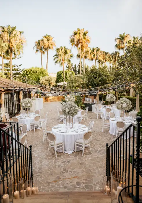 Wedding dinner setting in courtyard of typical Mallorcan finca