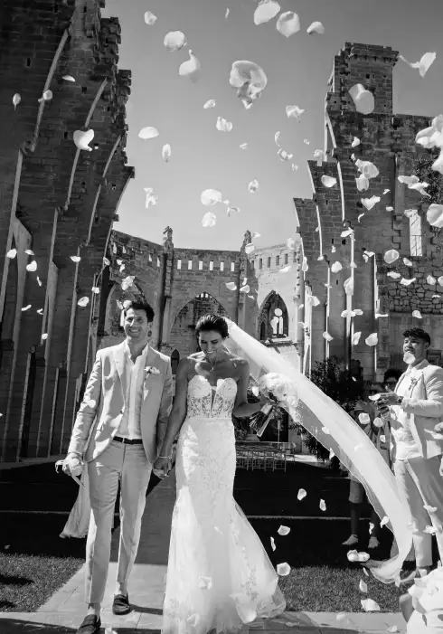 Couple leaving Iglesia Nova after their wedding ceremony in Mallorca